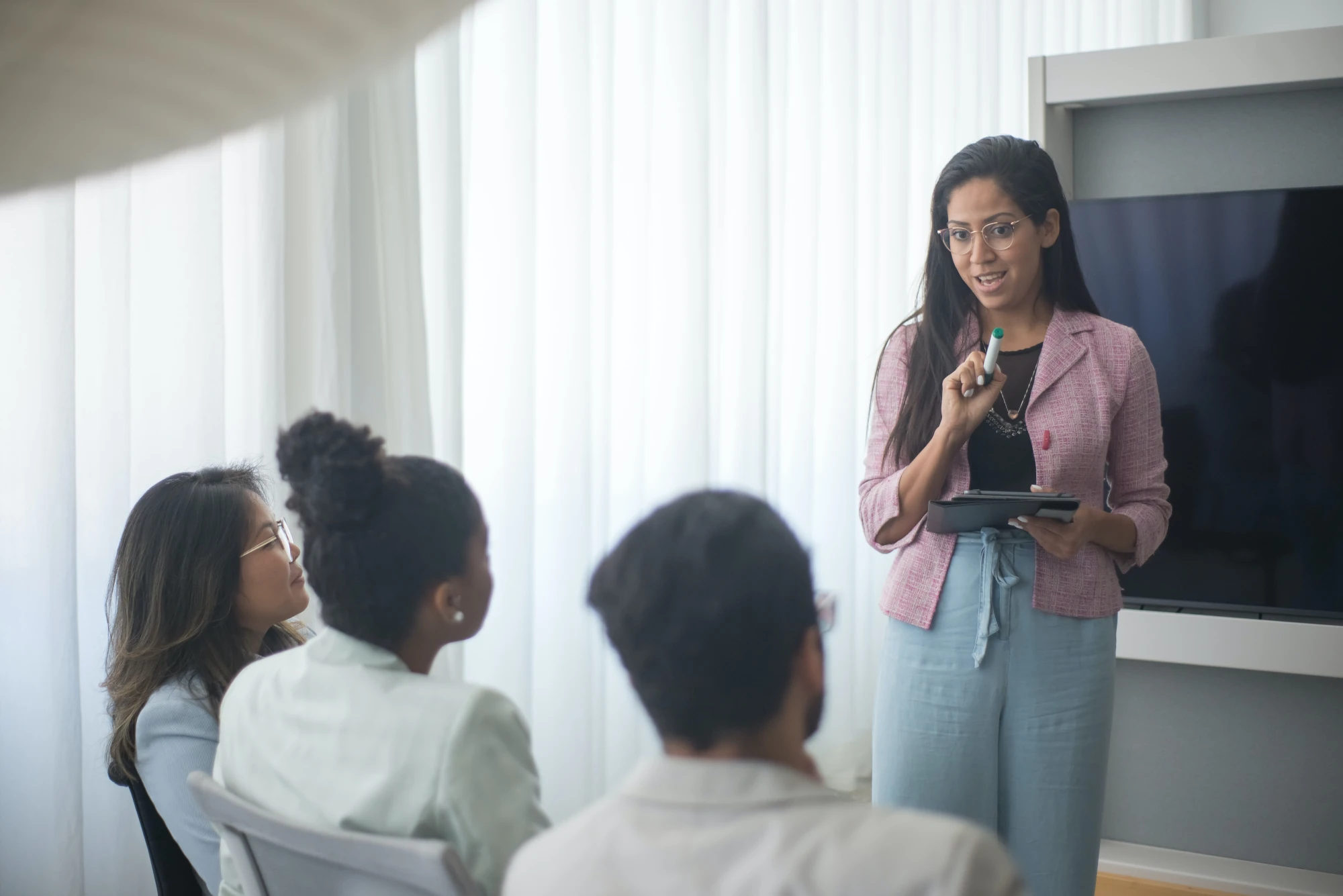 A mentor leading a small-group working session